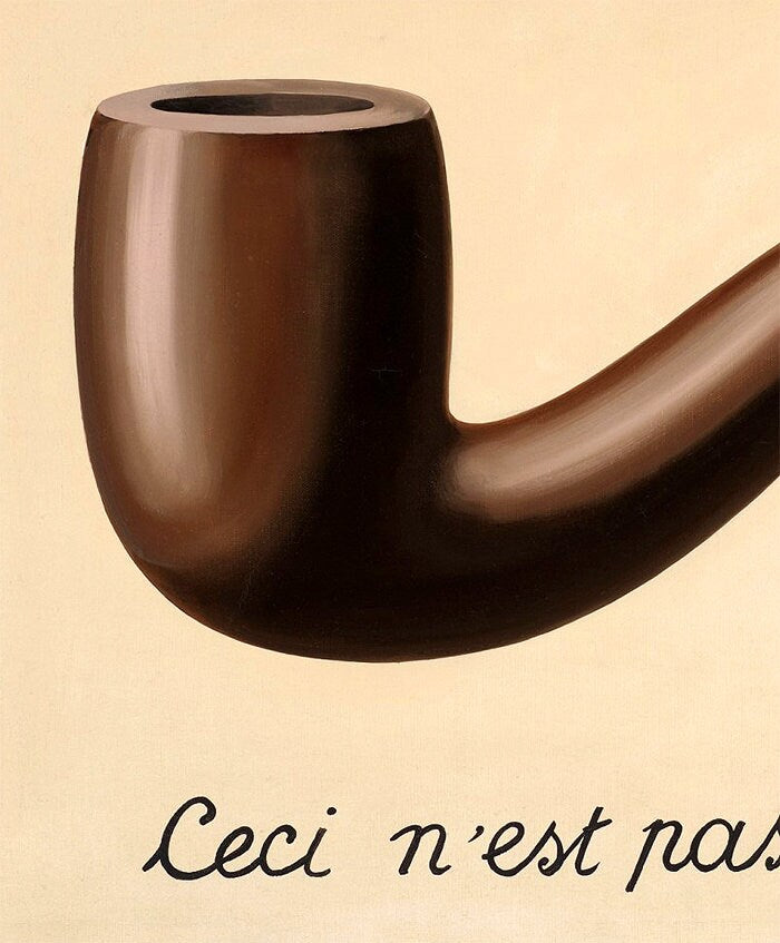 The Treachery of Images by René Magritte Framed Print